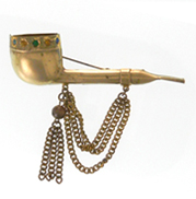 gold pipe brooch