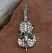 Beautiful vintage violin or cello brooch with multi-colored crystals and intricate details