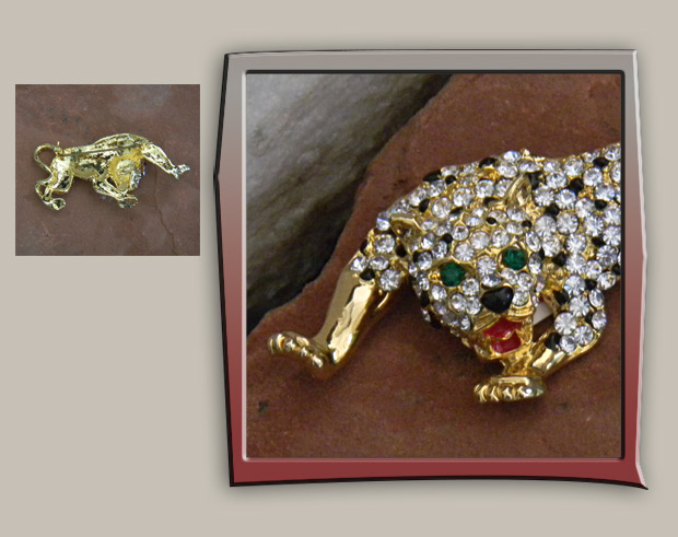 Exquisite cheetah vintage brooch with black enamel droplets amid the many rhinestones