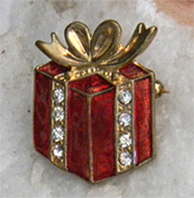 Festive red and gold vintage enamel brooch decorated with rhinestones. 