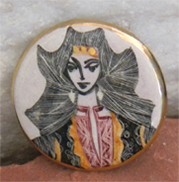 This button brooch has etching style drawing of power figure princess or goddess. 