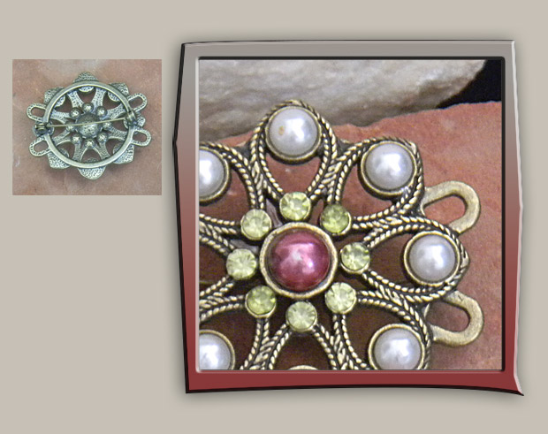 Bronze metal loop design brooch decorated with white pearls, yellow crystals and pink pearl