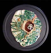 abstract volcano with green dripped glazes