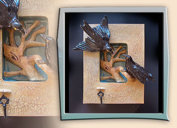 two ravens inteaing on tree with branches in niche box
    