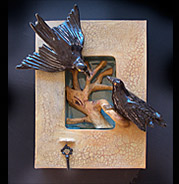 ceramic ravens interacting niche box