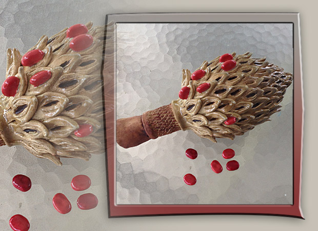 oversized magnolia seed pood with red seeds