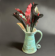 Black Calla Lilies and Leaves in Thrown Pitcher