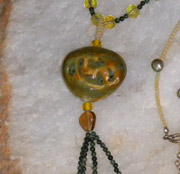 green ceramic pendant necklace with complimentary beads