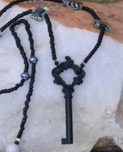 designer beaded necklace with black key on beaded strand