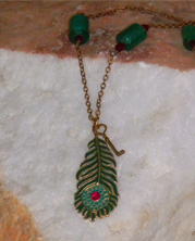 handmade designer necklace with chain and teal peacock feather pendant