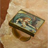 ring has scene from Alice in Wonderland