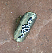 bronze band ring with snake in crystals