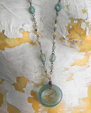 designer necklace with olive ceramic pendant