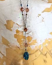 chain necklace with faceted amber and teal colored beads