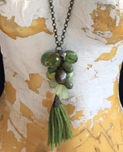designer necklace with pink and teal resin pendant