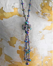 multi-colored glass beads with teal and purple hues