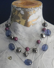 Triple-strand choker with large Lucite baubles