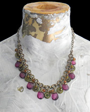 necklace with magenta faceted beads with elaborate chain